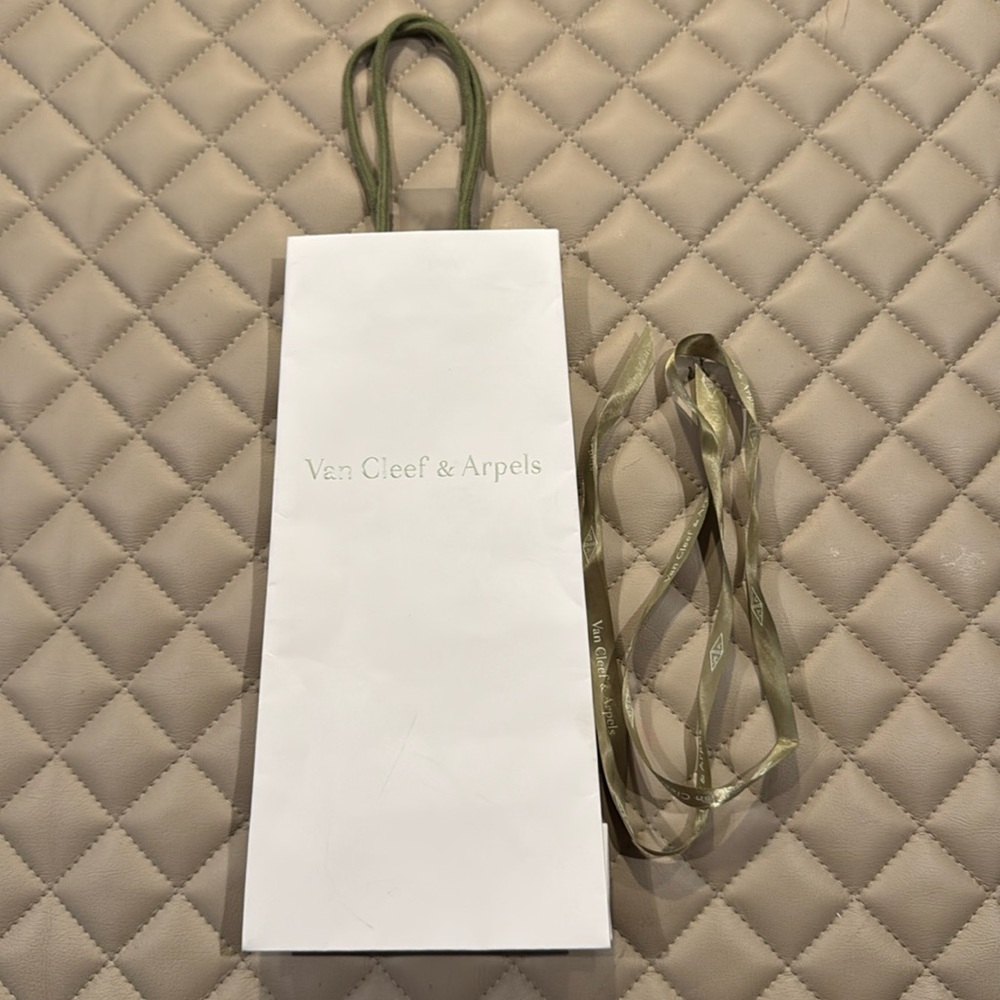 Van Cleef & Arpels shopping bag and ribbon.